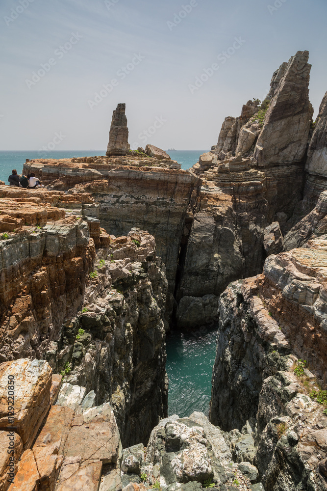 Steep and rugged cliff at the Taejongdae Resort Park in Busan, South Korea.