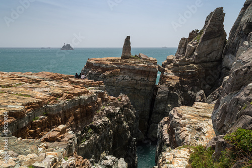 Steep and rugged cliff at the Taejongdae Resort Park in Busan, South Korea. © tuomaslehtinen