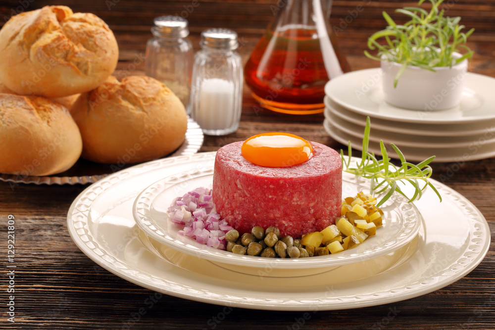 Beef tatare with egg, onion, cucumber and capers