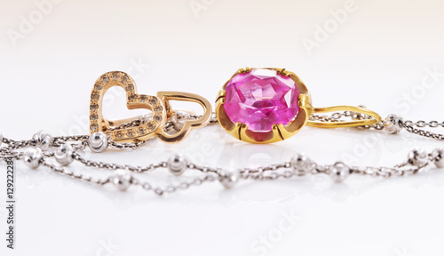 Gold earrings with ruby and heart-shaped
