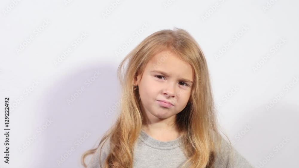 Thinking kid looking up and around. Beautiful young caucasian girl on white background. Little pretty girl thinking. Thinking kid looking up and around. Beautiful young caucasian girl on white background. Little pretty girl thinking.