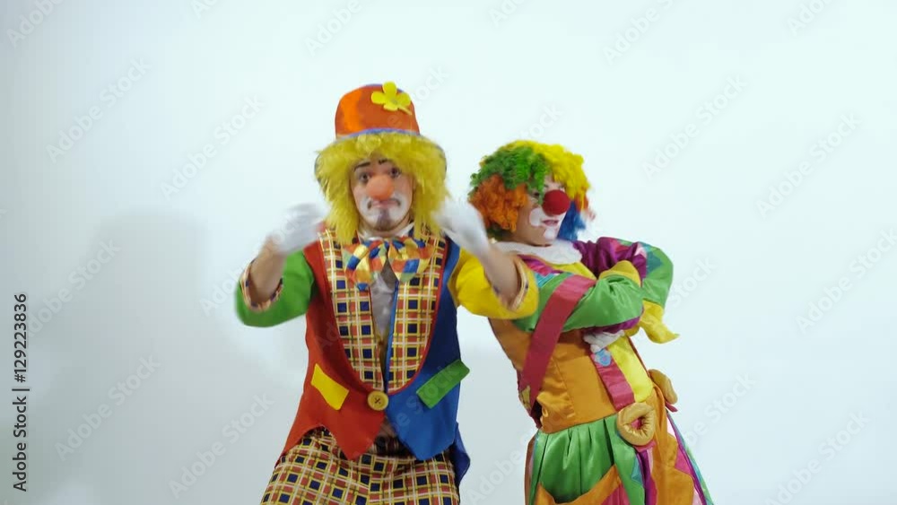 Portrait of two clowns finishing their zany dance Portrait of two clowns finishing their zany dance