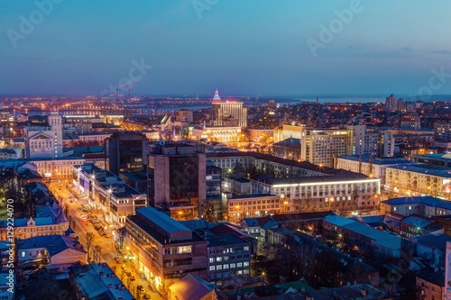 Evening cityscape from rooftop. Houses, trade centers, night lights. Voronezh 