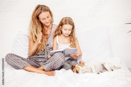 Woman with child reading book