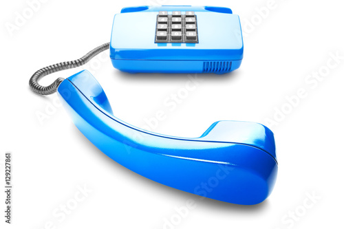 Landline phone in blue on isolated white background with shadow photo