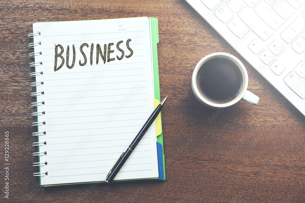 business word on notepad and desktop business word on notepad and desktop