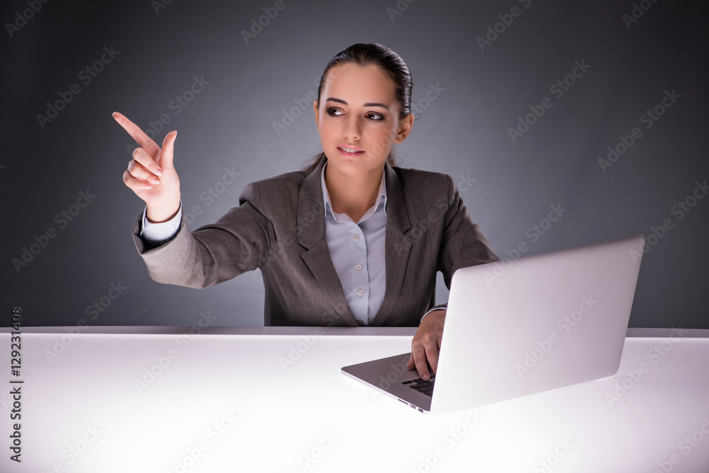 Businesswoman with laptop in business concept Businesswoman with laptop in business concept