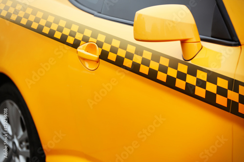 Yellow taxi cab, closeup. Taxi service concept.