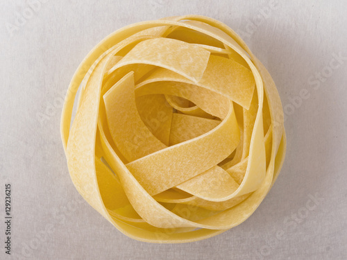 raw uncooked italian pappardelle pasta noodle photo