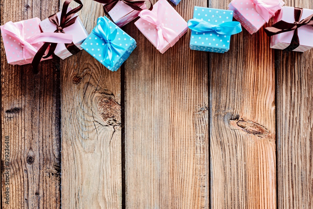Wooden Christmas background with small gifts Wooden Christmas background with small gifts
