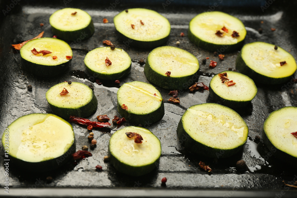 Squash slices on baking tray Squash slices on baking tray