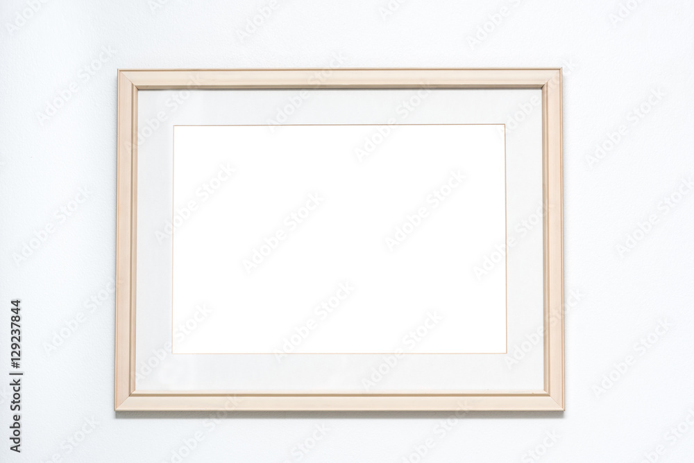 Blank picture frame on white wall background Blank picture frame on white wall background