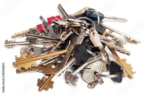 Heap of old keys isolated on white