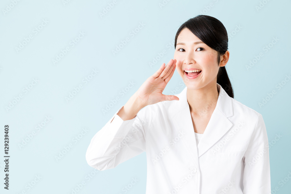 portrait of young asian nurse isolated on blue background portrait of young asian nurse isolated on blue background