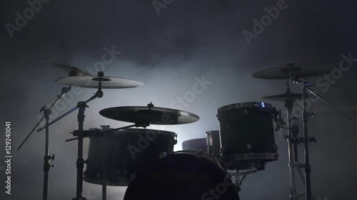 View of modern drum kit in smoky studio