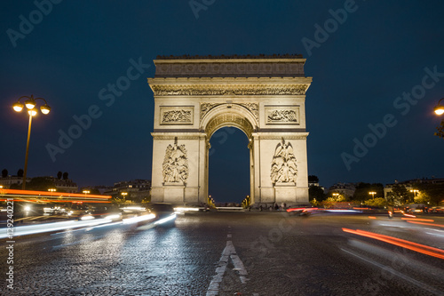 Triumphal arch. Paris. France. View Place Charles de Gaulle. Famous touristic architecture landmark in summer night. Napoleon victory monument. Symbol of french glory. World historical heritage. Toned © sergiymolchenko