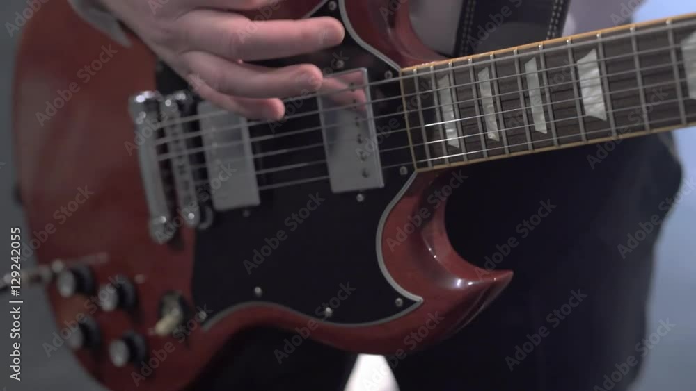 View on hands of musician playing guitar View on hands of musician playing guitar