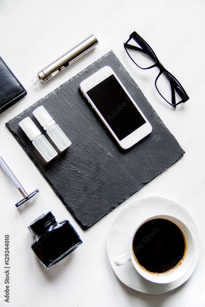 smartphone, electronic cigarette and men's accessories top view smartphone, electronic cigarette and men's accessories top view