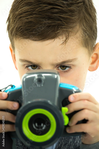 Little Boy Concentrating on His Camera