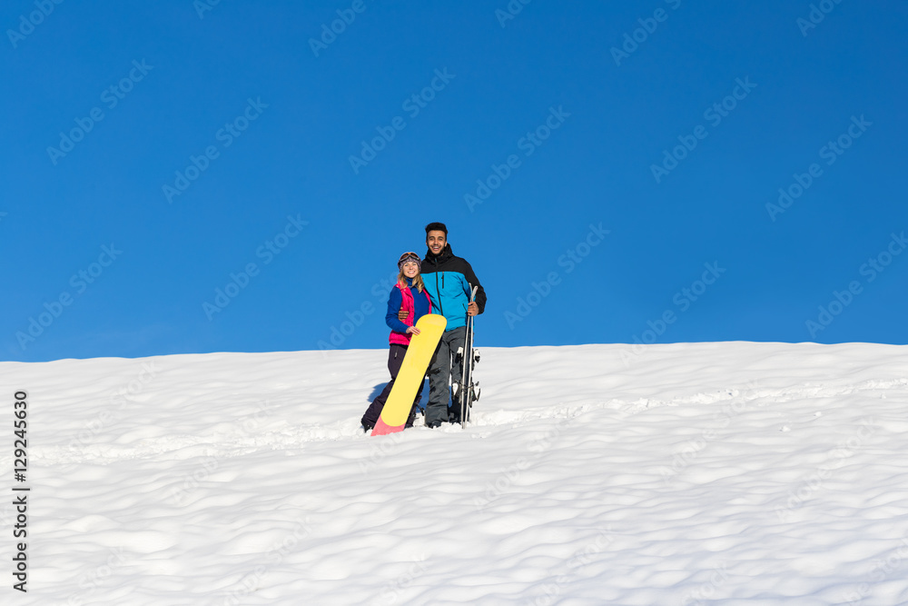 Couple With Snowboard And Ski Resort Snow Winter Mountain Cheerful Hispanic Man Woman Extreme Sport Vacation