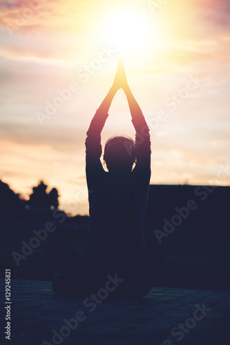Silhouette beautiful woman yoga on sunset. Sunset sky background.