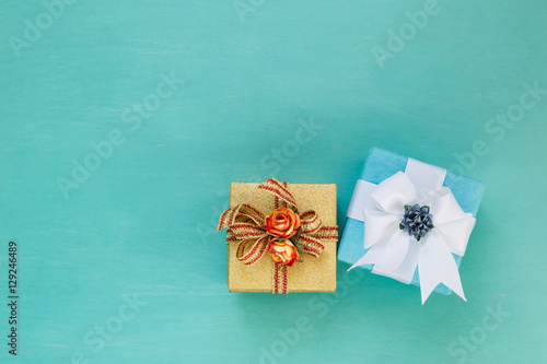 Gold and blue gift box on blue background, Christmas & New year present concept