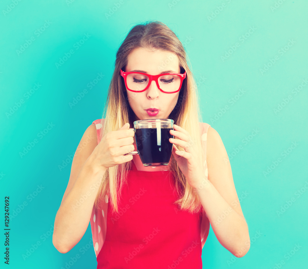 Happy young woman drinking coffee Happy young woman drinking coffee