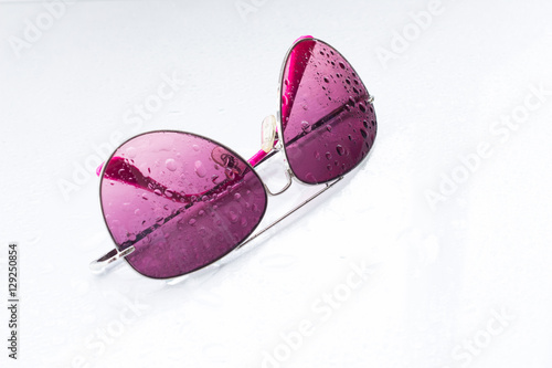 rose-colored glasses on white background photo