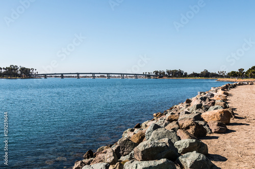 Rocky shoreline on Mission Bay in San Diego, California. © sherryvsmith