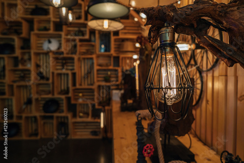Modern fashion lamp Edison interior loft room. Lantern with filament. © galaganov