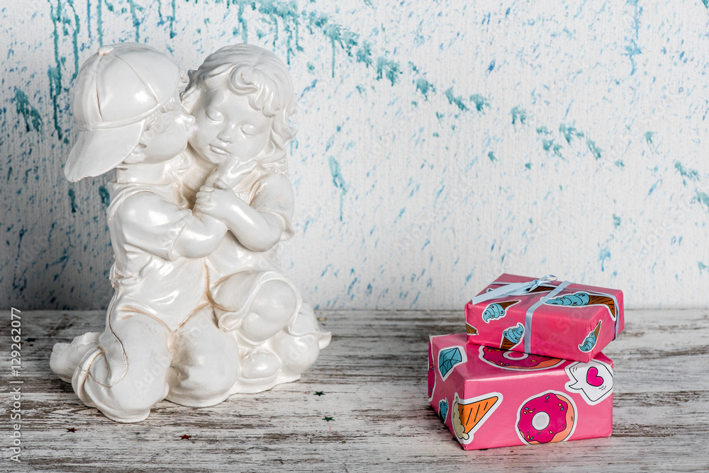 Fototapeta premium Gifts on light wooden background