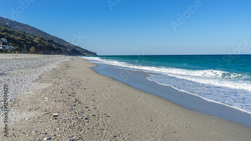 View on Mediterranean Sea with sunny sand beach. Chorefto village, Pelion, Greece.
