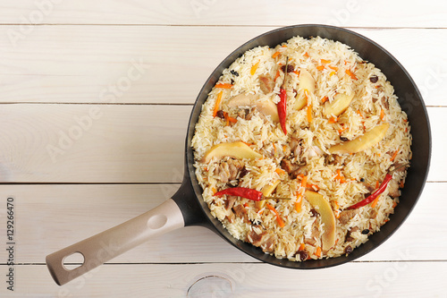 pan with pilaf with quince and chilli pepper