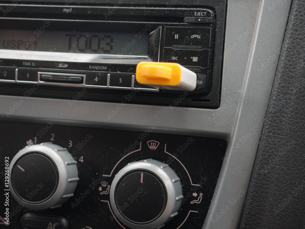 Fototapeta premium Stereo car plugs conssole with USB stick inserted.