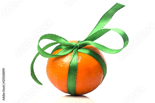 one gift ripe tangerine with green ribbon close