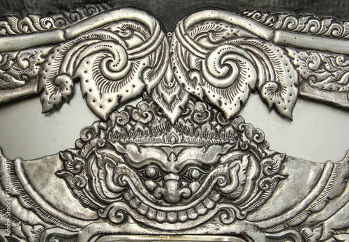 Decorative Art of Lanna Thai silver carving art on temple wall .