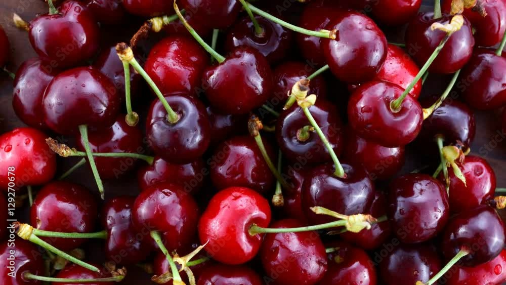 Delicious red fresh cherries closeup, rotating. Delicious red fresh cherries closeup, rotating.