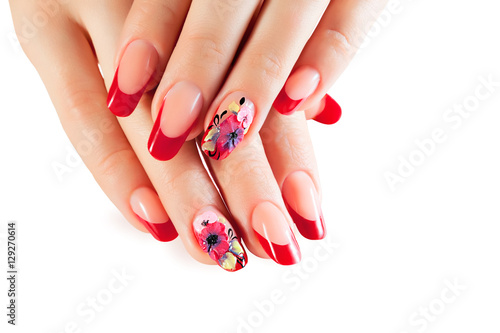 Female hands with New Year design on the nails holding snowflake.Isolated.
