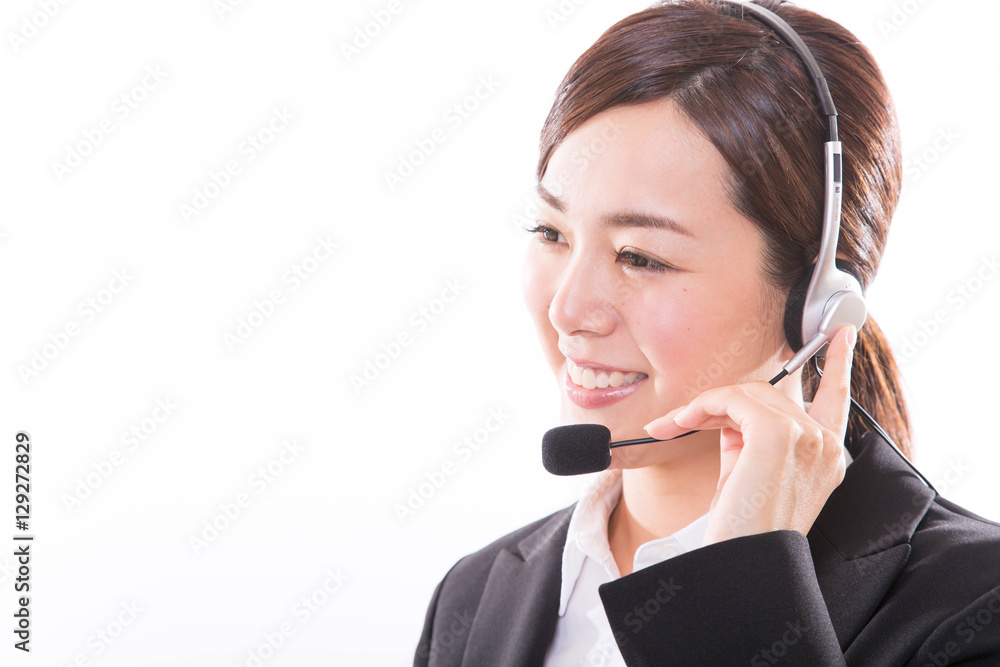 Young female customer service operator with headset and smiling Young female customer service operator with headset and smiling