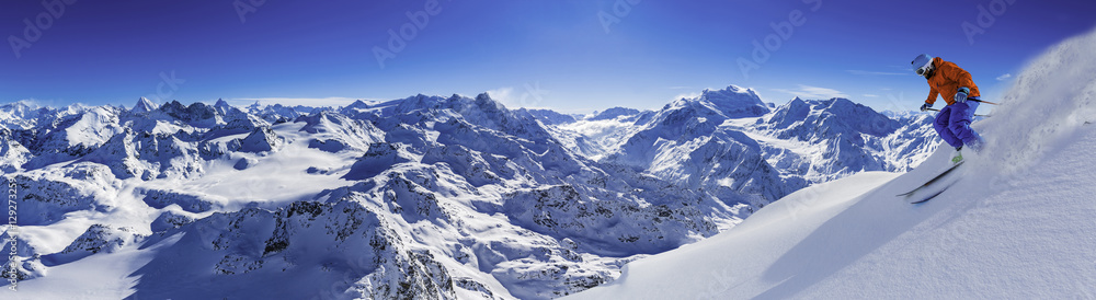 Skiing with amazing view of swiss famous mountains in beautiful