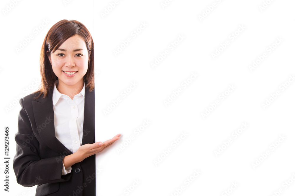 Smiling young business woman showing blank board while Smiling young business woman showing blank board while