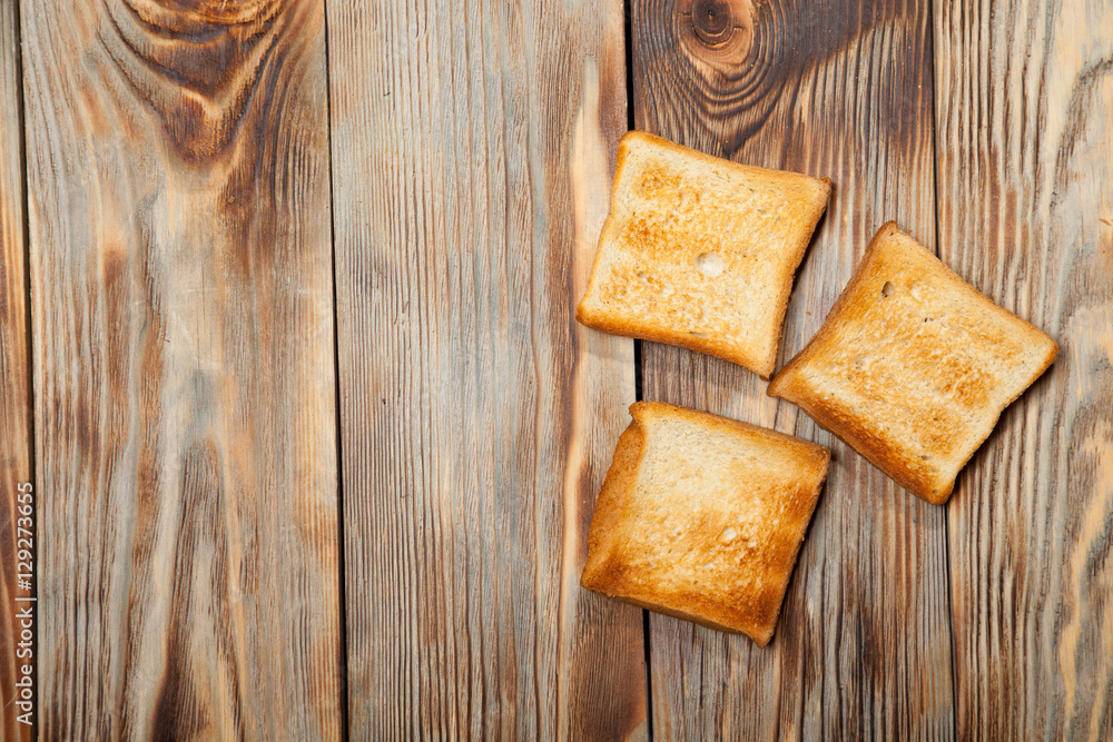 Toast on a rustic wooden background Toast on a rustic wooden background