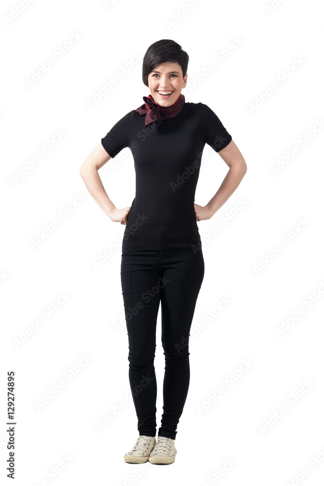 Fototapeta premium Cheerful happy woman looking at camera with hands on hips. Full body length portrait isolated over gray studio background.