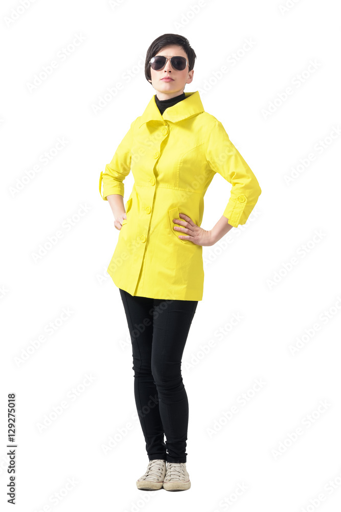 Confident proud woman in autumn clothes with sunglasses looking at camera. Full body length portrait isolated over gray studio background. Confident proud woman in autumn clothes with sunglasses looking at camera. Full body length portrait isolated over gray studio background.
