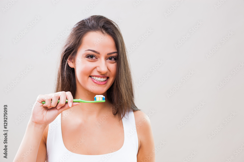 Young woman holding toothbrush. Dental hygiene concept. Young woman holding toothbrush. Dental hygiene concept.