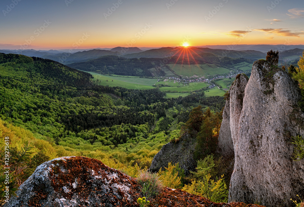 Landscape with forest mountains at sunset