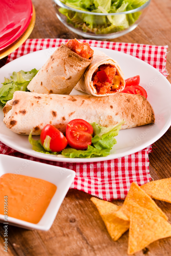 Tortilla wraps with chicken and vegetable. 
