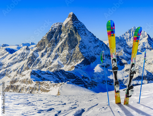 Fototapeta Ski Equipment with panoramic view of Matterhorn on a clear sunny winter day, Zermatt, Switzerland
