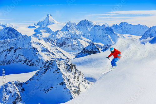 Skiing with amazing view of swiss famous mountains in beautiful. photo