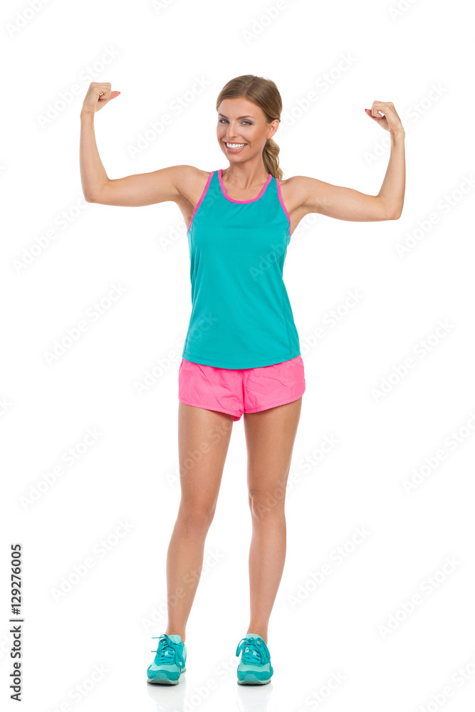 Fototapeta premium Strong Happy Woman Flexing Muscles